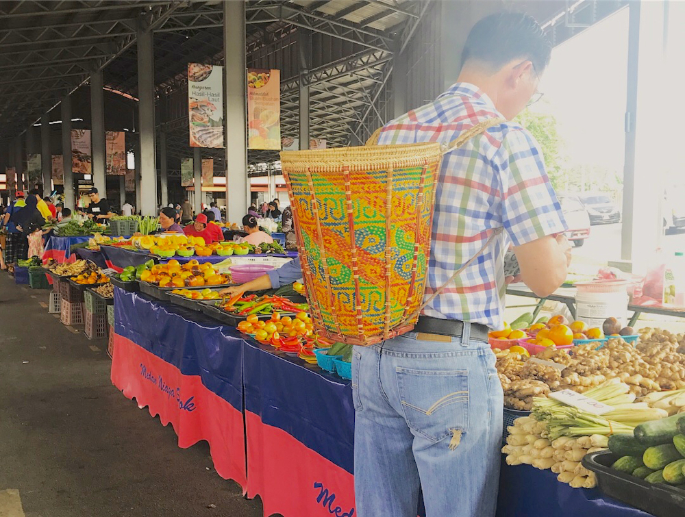 Man wearing a basket bag